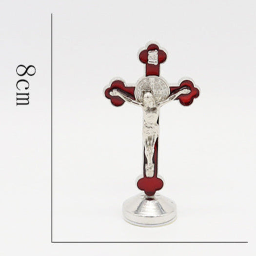 Small red crucifix religious cross figurine with measurements and weight on a white background
