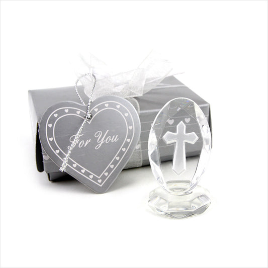 Crystal cross ornament and heart-shaped card with 'For You' text on a white background