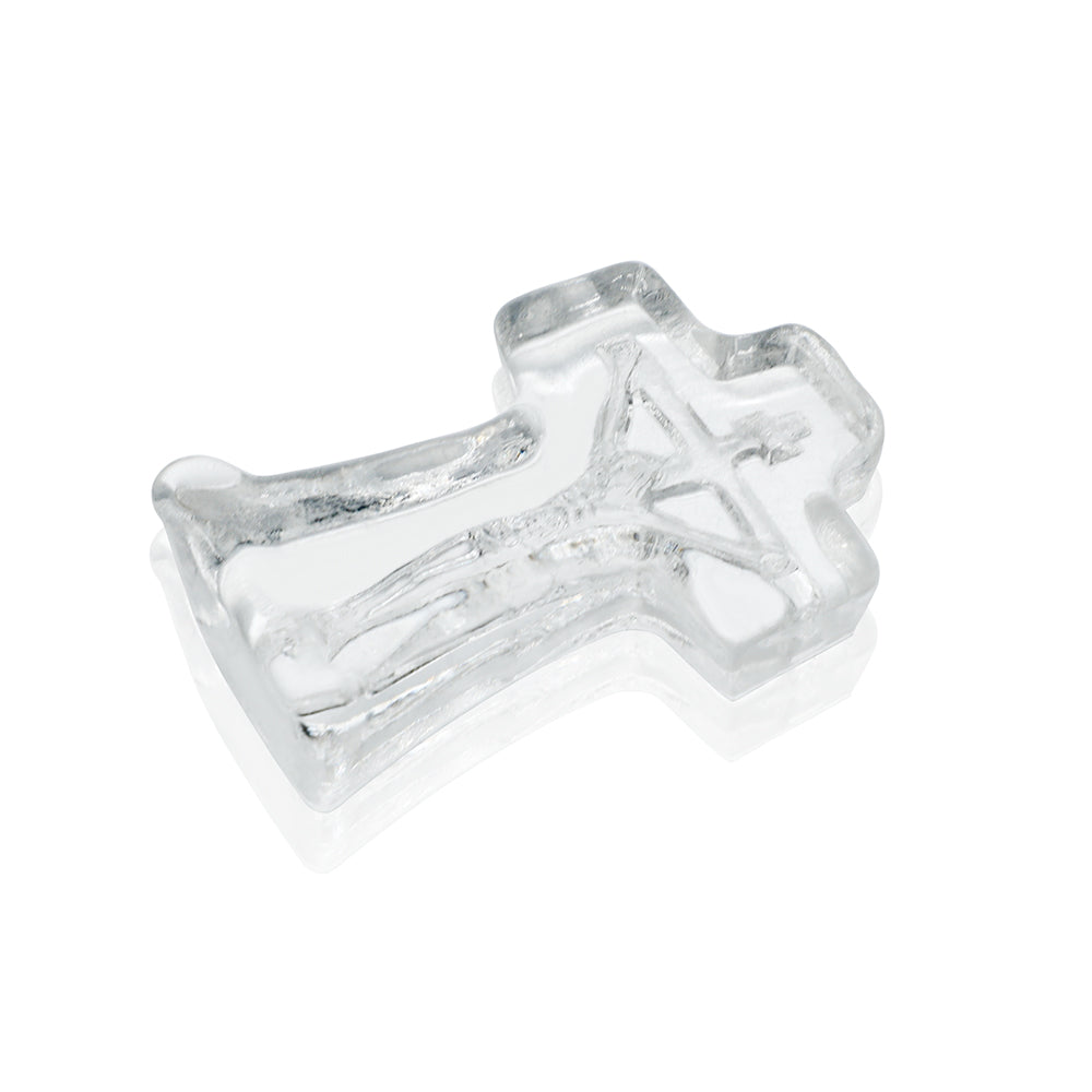Clear glass cross on a white background