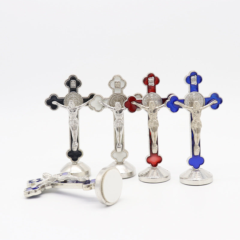 Set of silver crucifixes with colored accents on a white background