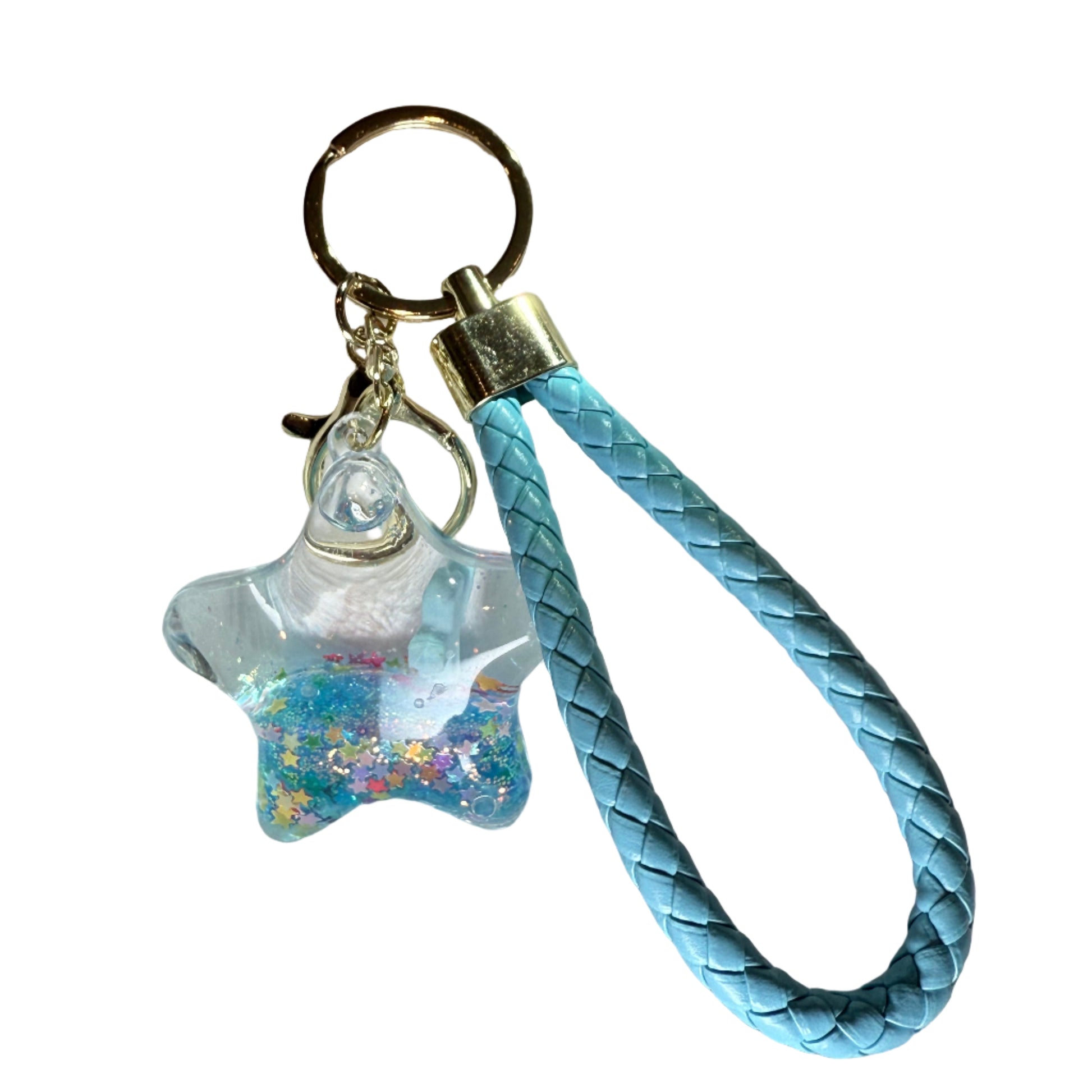 Light blue braided keychain with a clear charm on a textured white surface