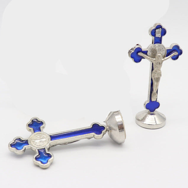 Blue metal crucifixes with colored accents on a white background